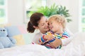 Mother and child in bed. Mom and baby at home Royalty Free Stock Photo