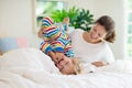 Mother and child in bed. Mom and baby at home Royalty Free Stock Photo