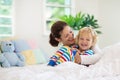 Mother and child in bed. Mom and baby at home Royalty Free Stock Photo