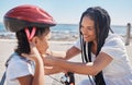 Mother, child or bike helmet help by beach, city ocean or sea in riding safety, learning security or fun activity Royalty Free Stock Photo