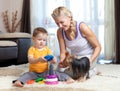 Mother, child boy and pet dog playing Royalty Free Stock Photo