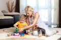 Mother, child boy and pet dog playing Royalty Free Stock Photo