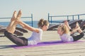 Mother and child doing sports outdoors