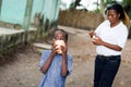 Mother and child eat a coconut