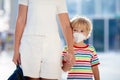 Mother and child with face mask and hand sanitizer Royalty Free Stock Photo