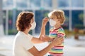 Mother and child with face mask and hand sanitizer Royalty Free Stock Photo