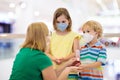 Mother and child with face mask and hand sanitizer Royalty Free Stock Photo