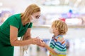 Mother and child with face mask and hand sanitizer Royalty Free Stock Photo