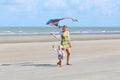 Mother and child flying kite on the beach Royalty Free Stock Photo