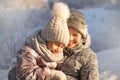 Mother and child girl having fun, playing and laughing on snowy winter. Royalty Free Stock Photo