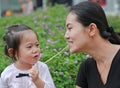 Mother and child girl playing bubble gum. Happy loving family Royalty Free Stock Photo