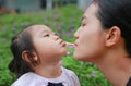 Mother and child girl playing bubble gum. Happy loving family Royalty Free Stock Photo