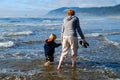 Mother Child Hand in Hand on Beach