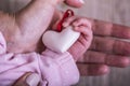 Mother and child hands holding white heart, health care love and family concept. World humanitarian day theme Royalty Free Stock Photo