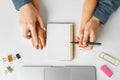 Mother and child hands writing in a notepad, top view Royalty Free Stock Photo