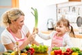 Mother and child having fun preparing healthy food Royalty Free Stock Photo
