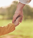 Mother, child and holding hands for walking in park for support, trust and care together or bonding in nature. Love Royalty Free Stock Photo