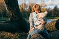 Mother and child hugging at autumn park near the lake Royalty Free Stock Photo