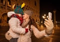 Mother and child hugging while taking selfie on Piazza San Marco Royalty Free Stock Photo