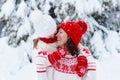 Mother and child in knitted winter hats in snow Royalty Free Stock Photo