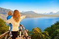 Mother with child look at amazing tropical lake in mountains Royalty Free Stock Photo