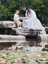 Mother and Child by lotus pond Royalty Free Stock Photo