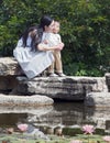 Mother and Child by lotus pond Royalty Free Stock Photo