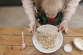 Mother and child mixing ingredients in a bowl in the kitchen together. Royalty Free Stock Photo