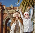 Mother and child near Arc de Triomf in Barcelona rejoicing