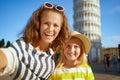 Mother and child near leaning tower in Pisa taking selfie Royalty Free Stock Photo