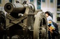 A mother and child near the old cannons.