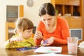 Mother and child painting with handprinting