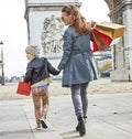 Mother and child in Paris, France looking aside and walking Royalty Free Stock Photo