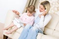 Mother and child - on the phone in living room Royalty Free Stock Photo