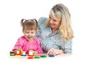 Mother and child play with colorful puzzle toy