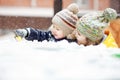 Mother with child play in snow on winter walk, positive emotions, outdoor. Snowfall, blizzard.