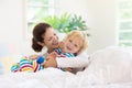 Mother and child in bed. Mom and baby at home Royalty Free Stock Photo