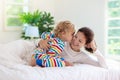 Mother and child in bed. Mom and baby at home Royalty Free Stock Photo