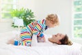 Mother and child in bed. Mom and baby at home Royalty Free Stock Photo