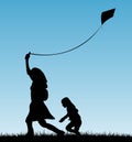 Mother and child playing with kite Royalty Free Stock Photo