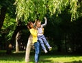 Mother and child playing at summer city park on nature Royalty Free Stock Photo