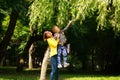 Mother and child playing at summer city park on nature Royalty Free Stock Photo