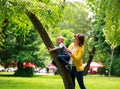 Mother and child playing at summer city park on nature Royalty Free Stock Photo