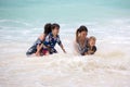 Mother and child playing at tropical beach. Family sea summer vacation. Mom and kid, toddler boy, play in the water. Ocean and Royalty Free Stock Photo