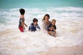 Mother and child playing at tropical beach. Family sea summer vacation. Mom and kid, toddler boy, play in the water. Ocean and Royalty Free Stock Photo