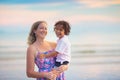 Mother and child playing on tropical beach Royalty Free Stock Photo