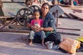 mother with child rests on the courtyard of Jama Masjid Mosque in Delhi. Jama Masjid is the principal mosque of Old Delhi in India