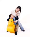 mother and child riding toy horse