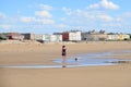 Mother and child on sand beach