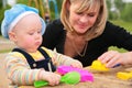 Mother and child in sandbox